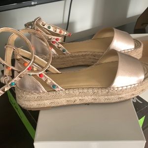 gold metallic ankle wrap open toe espadrilles.